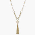Long gold-plated necklace with freshwater pearls, chunky chain links, and flowing tassel pendant