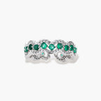 Platinum-plated copper ring with green zirconia stones in decorative scalloped wave pattern, adjustable band design.