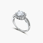 Close-up of sterling silver halo ring with brilliant round moissanite center stone surrounded by smaller accent stones
