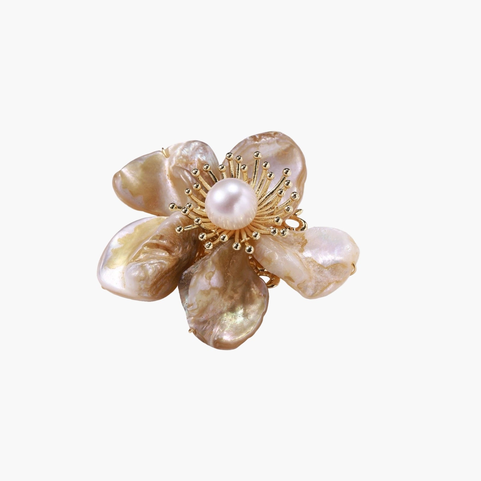 Flower-shaped brooch with iridescent shell petals, freshwater pearl center, and gold-plated radiating details.
