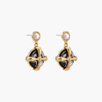Gold-plated drop earrings with iridescent abalone shell and pearl studs in geometric cross design