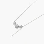 White gold plated Y-shaped necklace with three dimensional flower charms and adjustable drop pendant