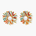 Vibrant starburst stud earrings with multicolor enamel rays and white pearl centers on gold-plated setting