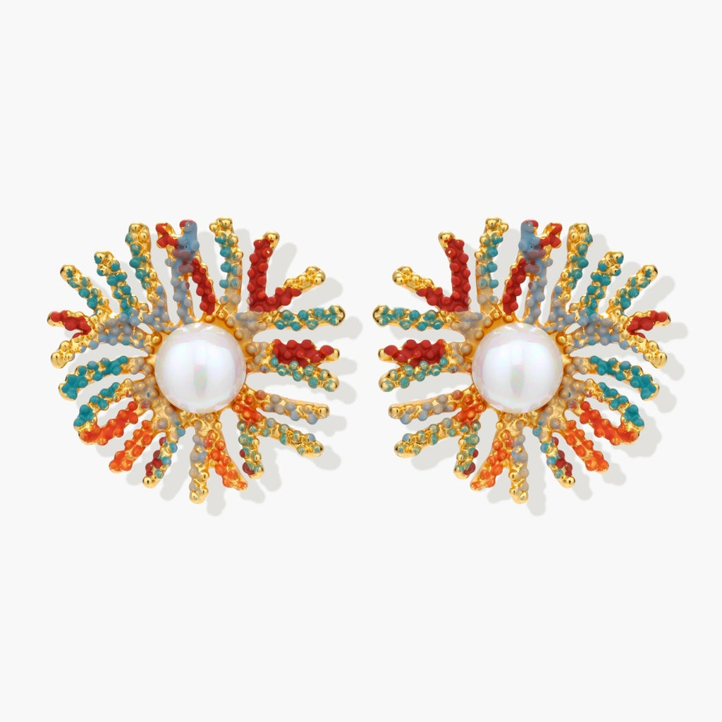 Vibrant starburst stud earrings with multicolor enamel rays and white pearl centers on gold-plated setting