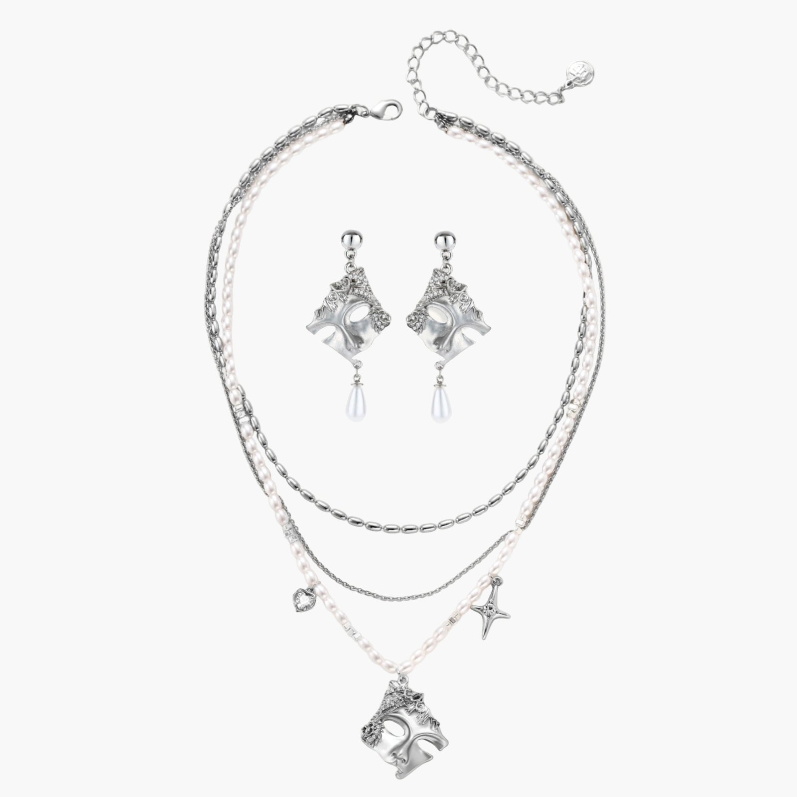 Ornate silver-toned masquerade mask jewelry set featuring rhinestone details and pearl drop earrings on white background.