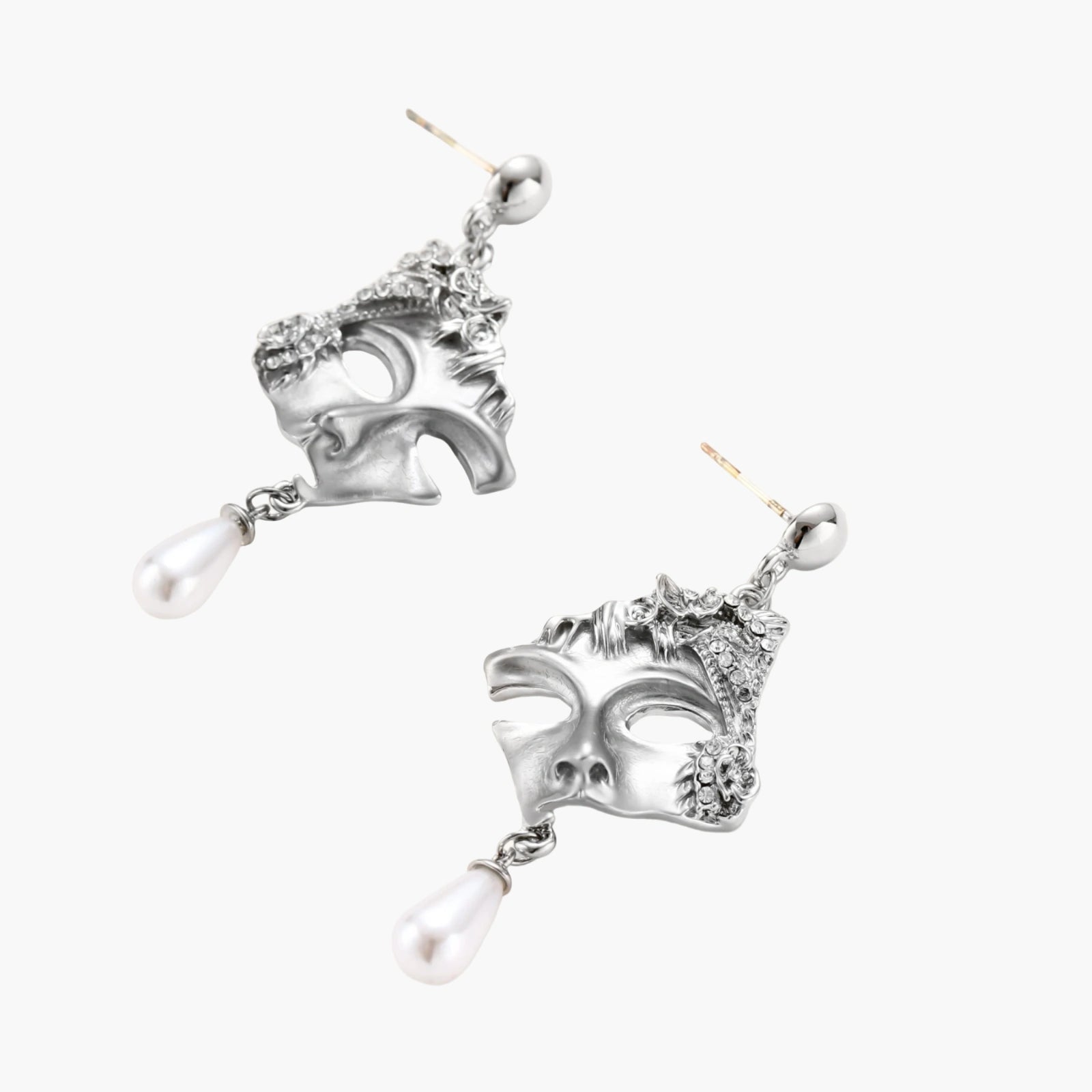 Ornate silver-toned masquerade mask jewelry set featuring rhinestone details and pearl drop earrings on white background.