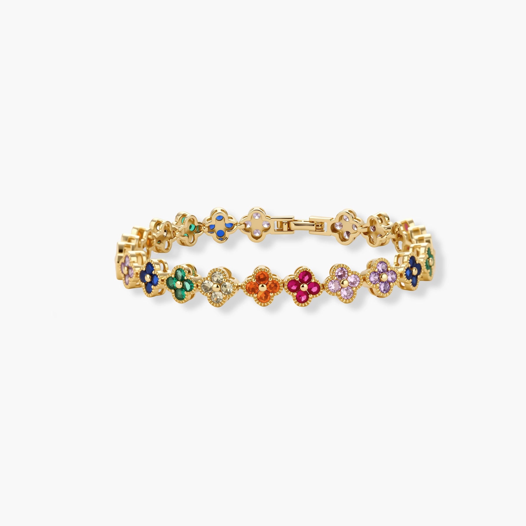 Colorful four-leaf clover jewelry set with rainbow cubic zirconia stones in gold-plated setting on white background