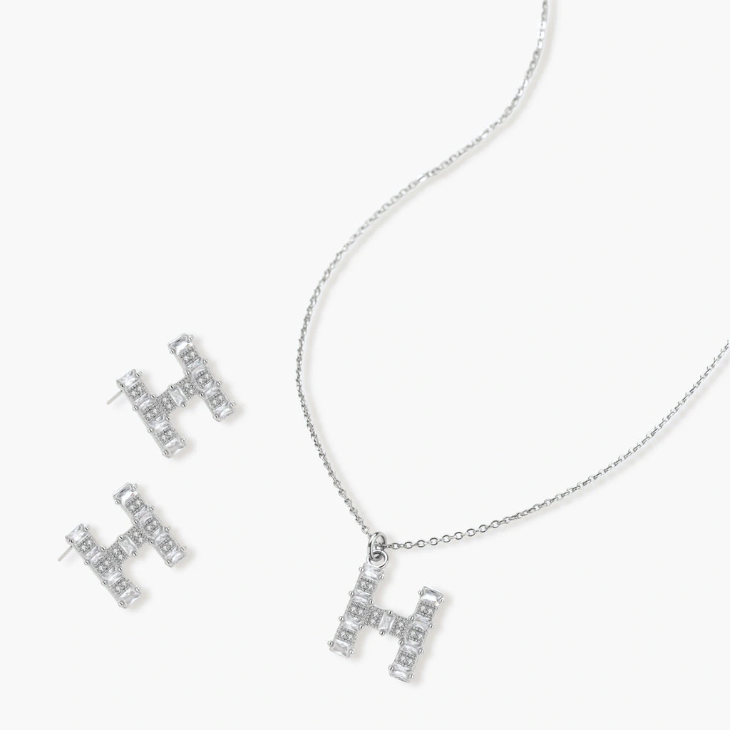 Letter H jewelry set featuring geometric crystal design in gold and white gold plated finish with adjustable chain necklace