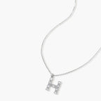 Letter H jewelry set featuring geometric crystal design in gold and white gold plated finish with adjustable chain necklace