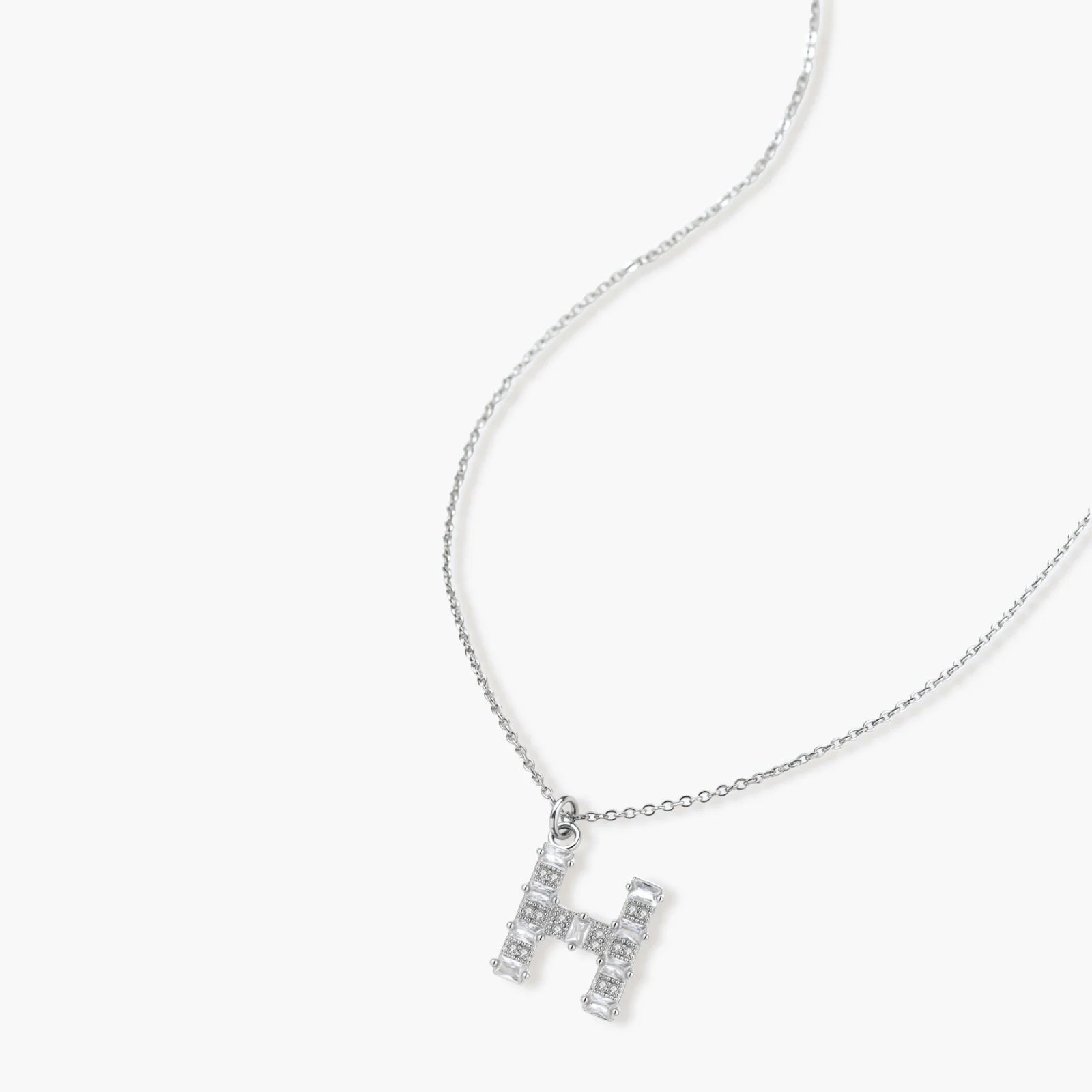 Letter H jewelry set featuring geometric crystal design in gold and white gold plated finish with adjustable chain necklace